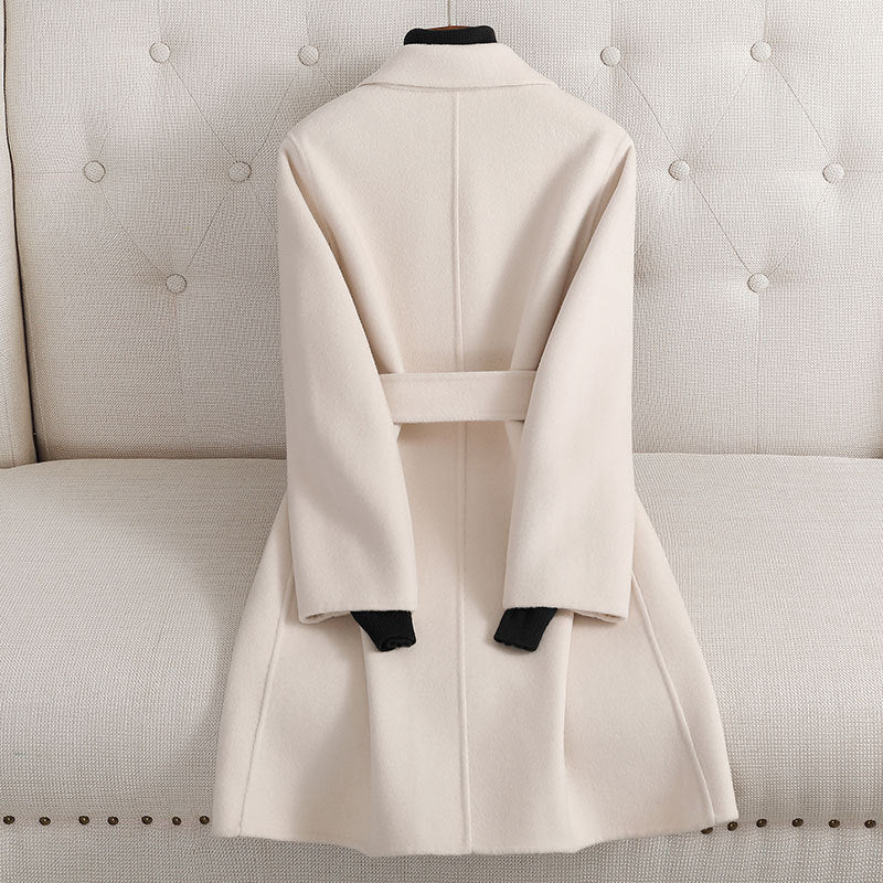 Buy a timeless double-sided cashmere coat in soft neutral tones for winter.